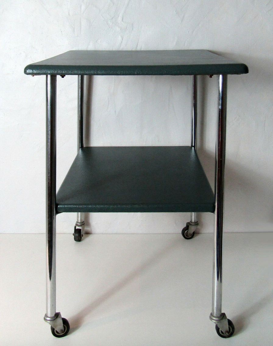 Table serves console with chrome wheels and imitation vintage khaki