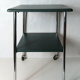 Table serves console with chrome wheels and imitation vintage khaki