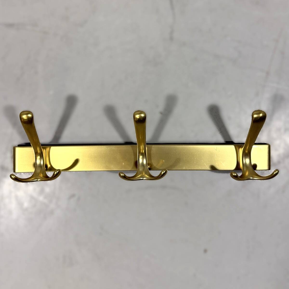Gold coloured aluminium wall coat racks 1960’s