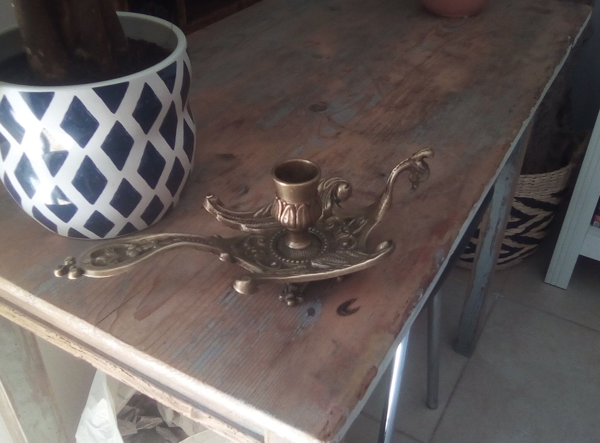 Old hand candlestick in chissed solid brass