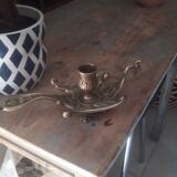Old hand candlestick in chissed solid brass