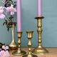 Set of 3 antique brass candle holders/candelabra.