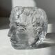Glass candlestick by Bertil Vallien for Kosta Boda, man's head.
