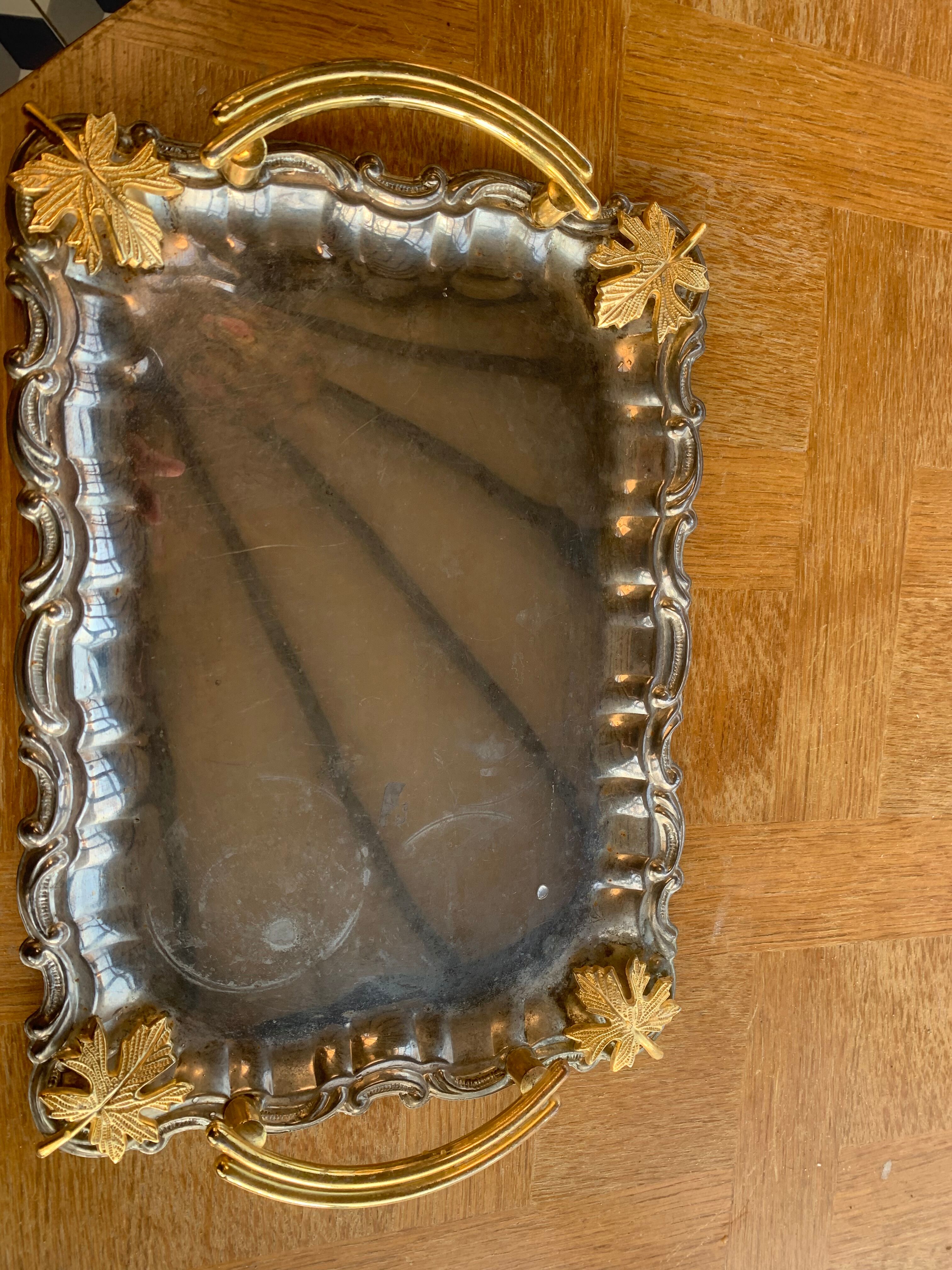 Silver metal top and decoration of foliage and handles in vintage brass