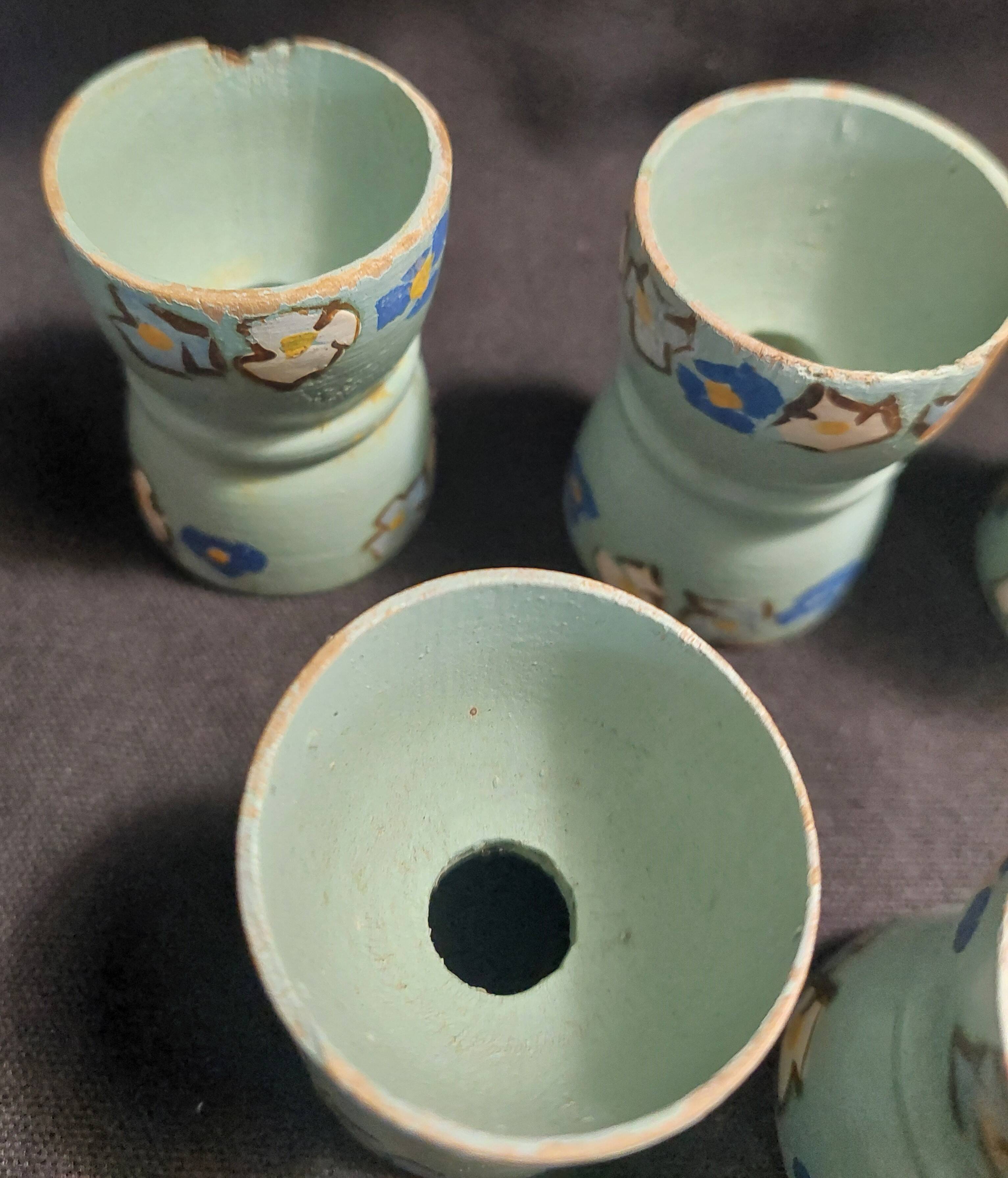 Antique painted wooden egg cups, set of six from the 1930s.