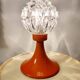 Space age lamp in orange glass and metal, around 1960.
