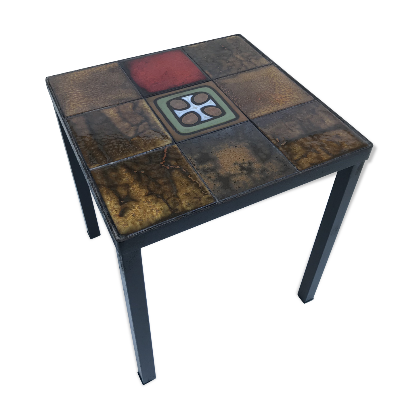 Old black metal and majolica tiles table