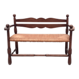 Vintage bench with wooden backrest and structure and mulched seat