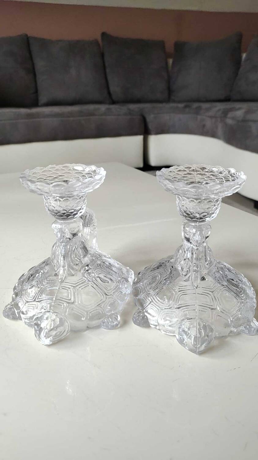 Pair of hand candlesticks/glassware from Portieux/Vallerysthal. In molded glass. Zoomorphic form of turtle carrying a griffin on its back.