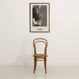 Bistro chair with curved wooden armrests and canning seat