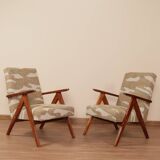 Pair of vintage lounge chairs in brown jacquard fabric and wood.