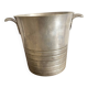 Antique champagne bucket with shell handles.