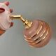 Vintage globe wall light in frosted pink and gold glass.