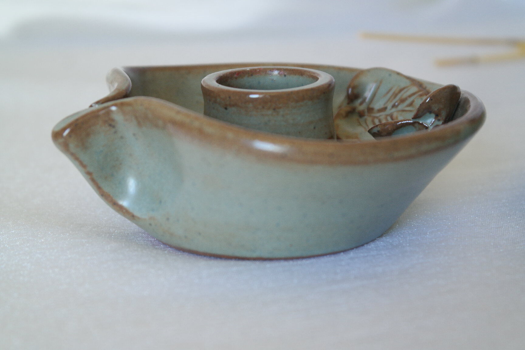 Pair of cellar rat candle holders in glazed sandstone