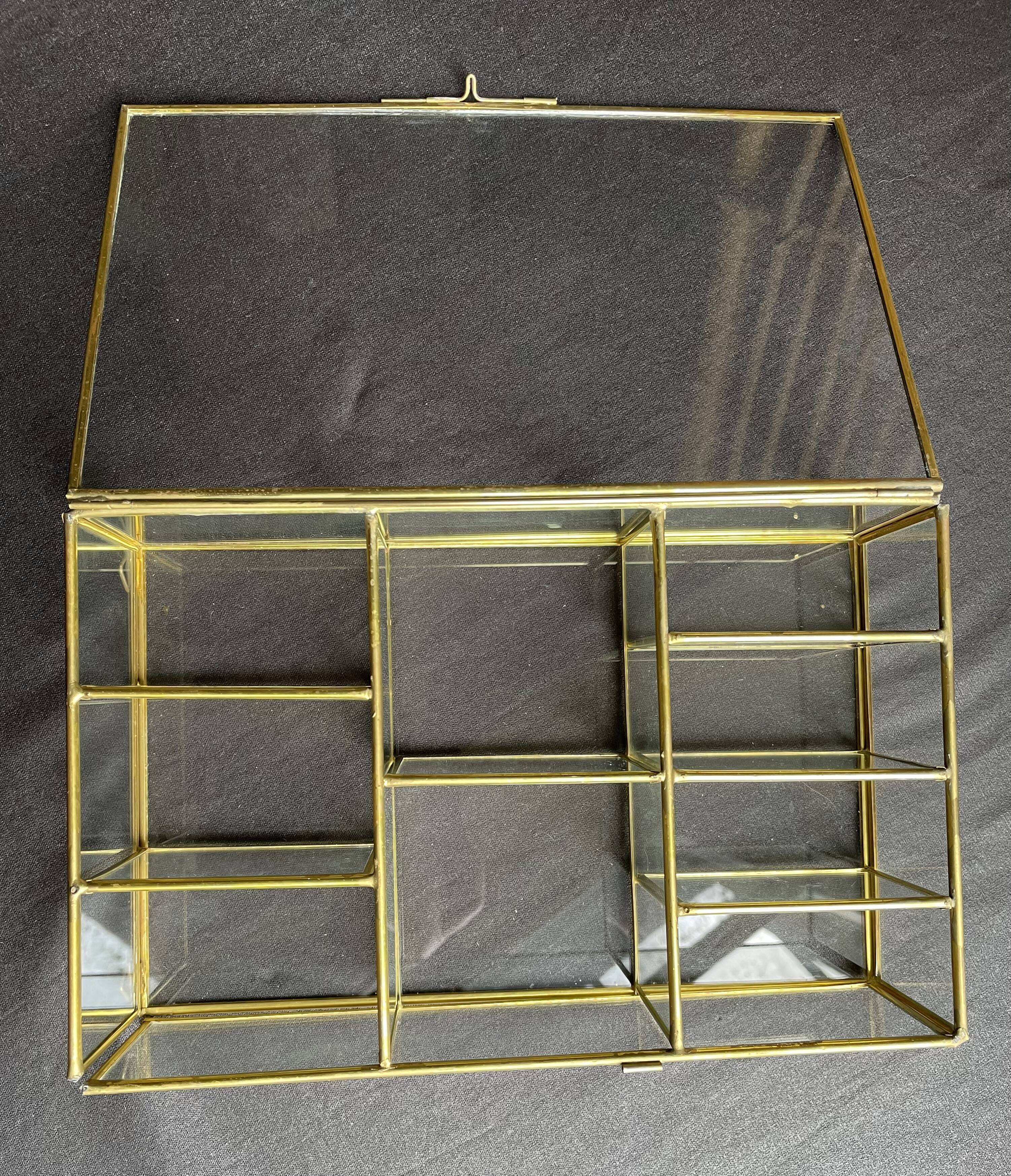 Glass and brass wall display case