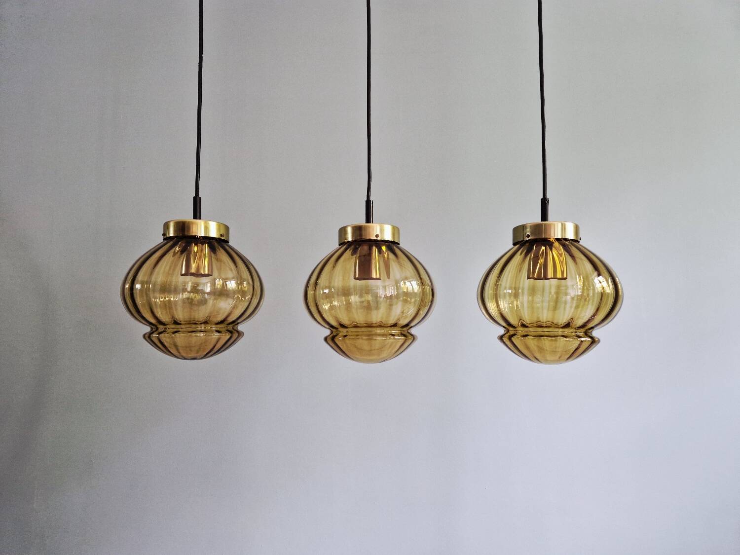 Set of 3 amber glass pendant lights, RAAK Amsterdam, 1970