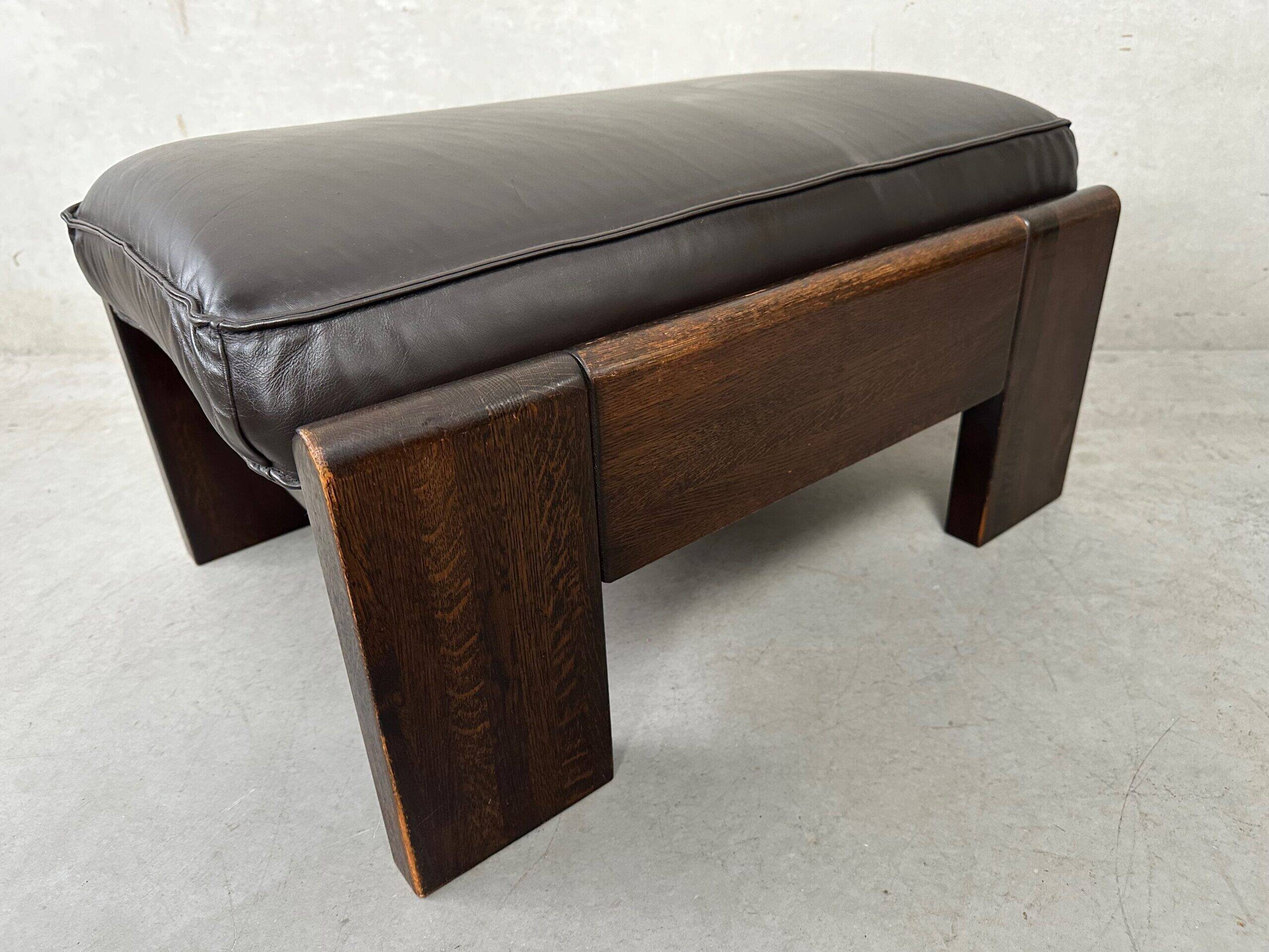 Vintage Leolux brown leather/oak lounge chair and ottoman by Harry de Groot – 1970