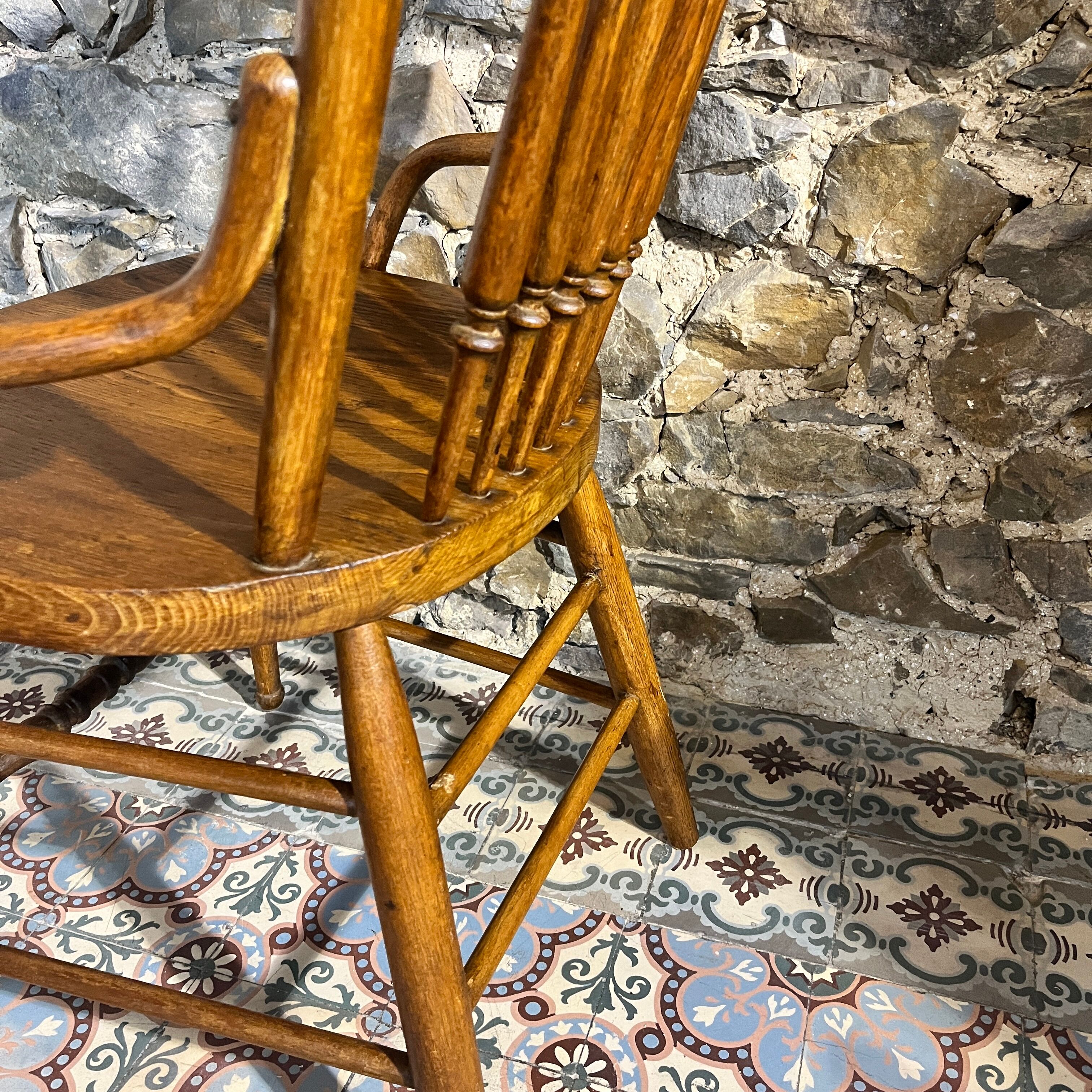 Wooden armchair with high back