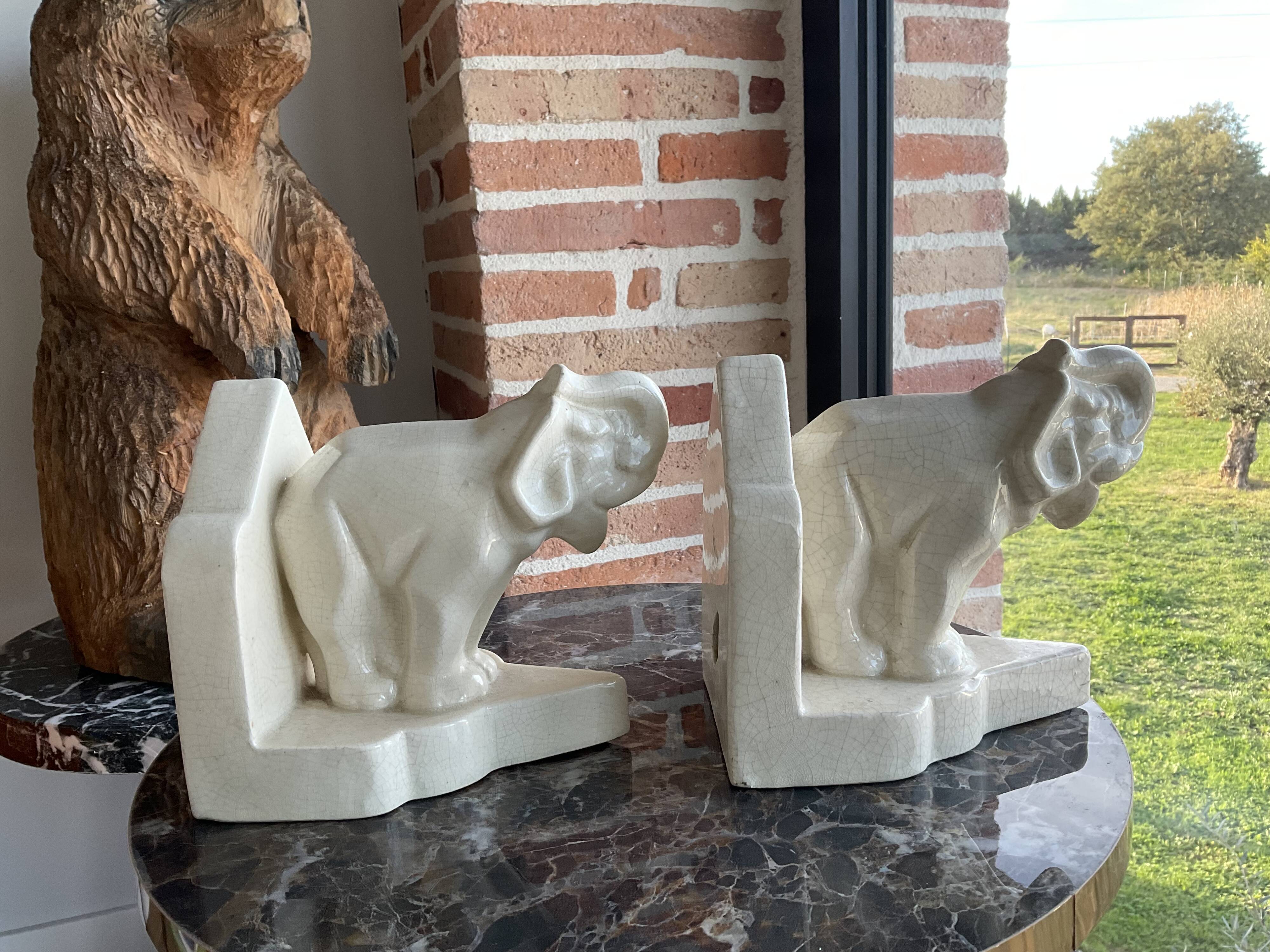 Pair of cracked earthenware bookends. ART DECO