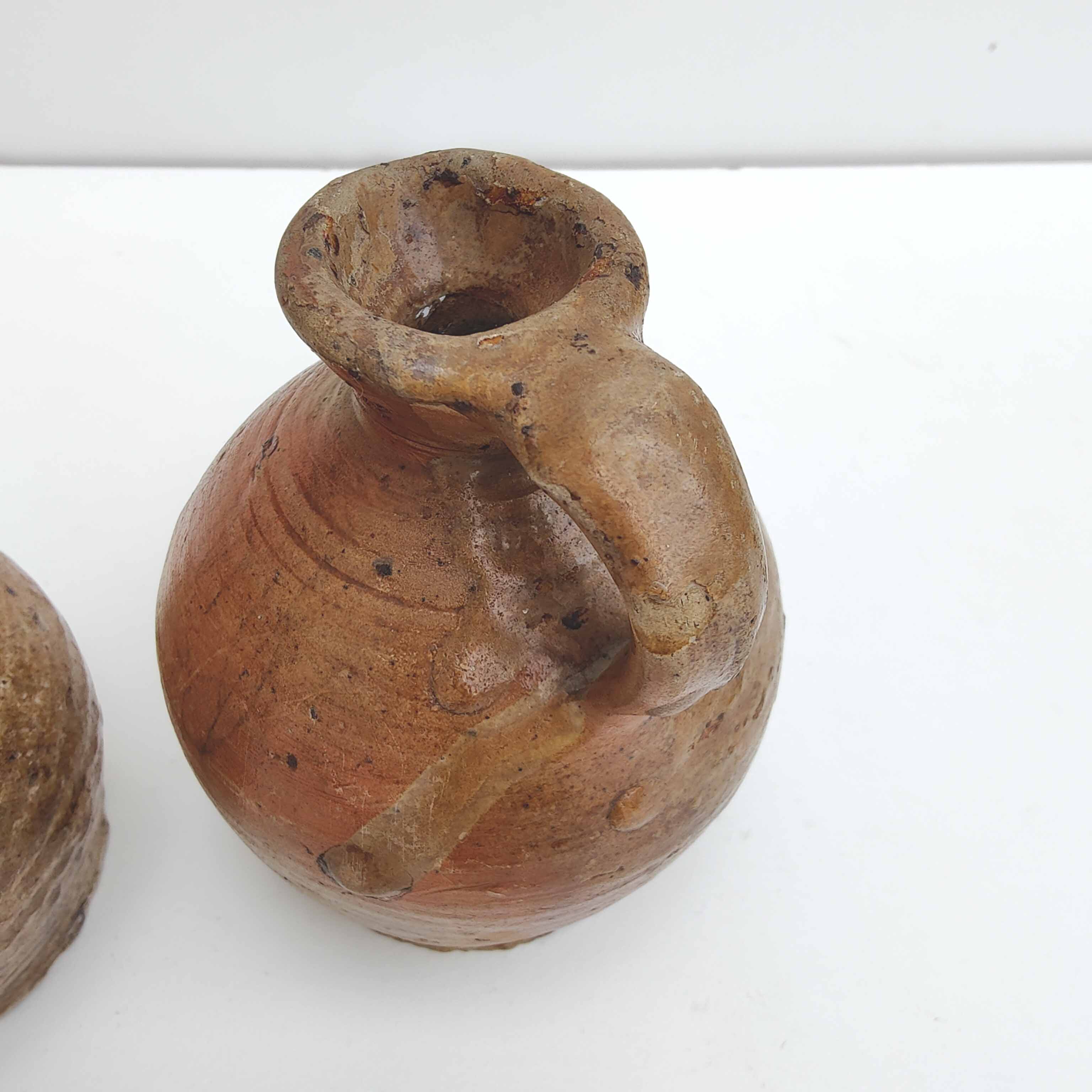 Set of two small sandstone pitchers