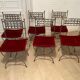 6 chaises curule en fer forgé avec assise en velours rouge