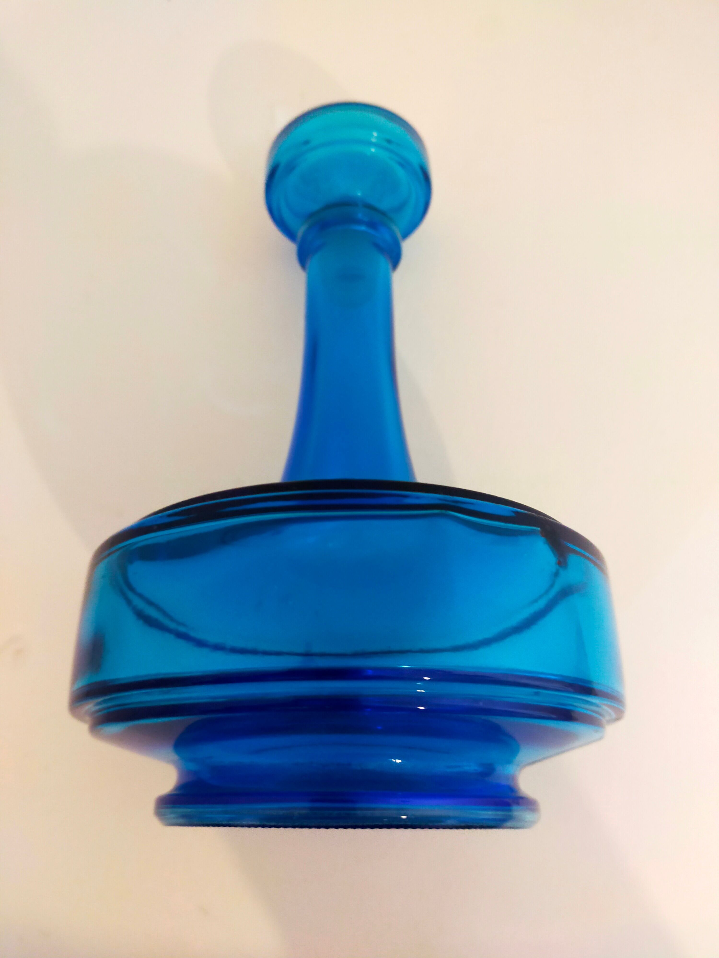 Bottle of old perfume of blue color