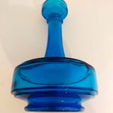 Bottle of old perfume of blue color