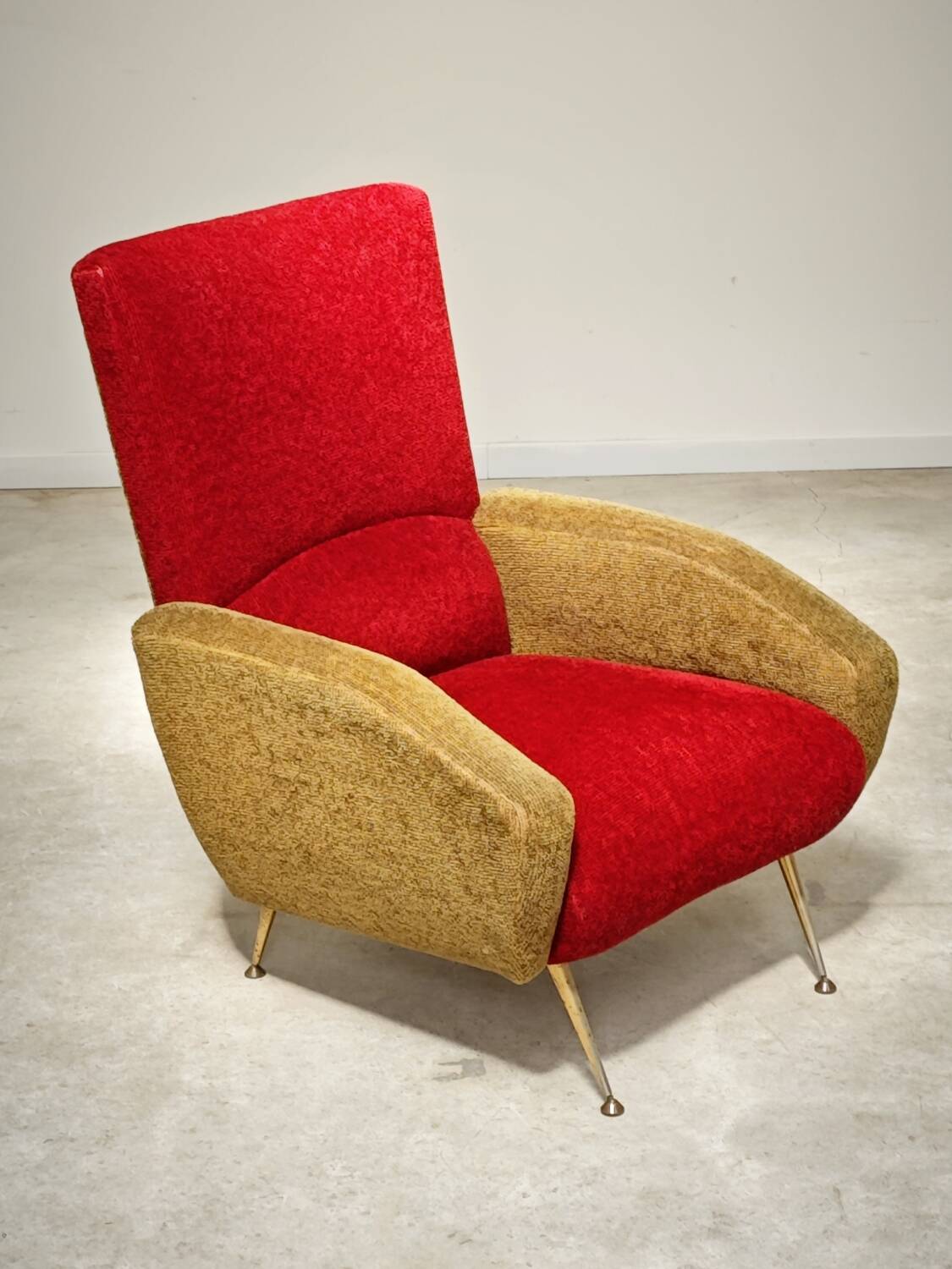 Red and mustard yellow fabric armchair in 1970s style