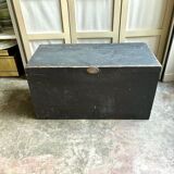 Trunk, black wooden chest and wallpaper
