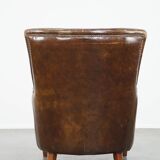 Grained cowhide armchair with a timeless design