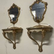 Pair of wall-mounted consoles with a mirror in Louis XV style.