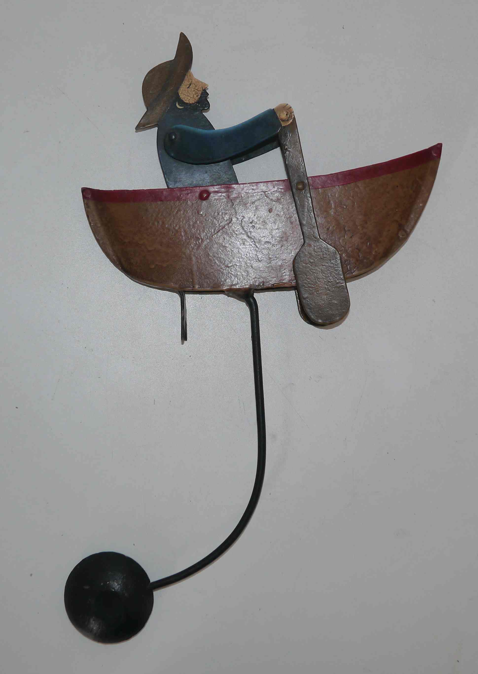 Old fishing counter balance toy in a boat