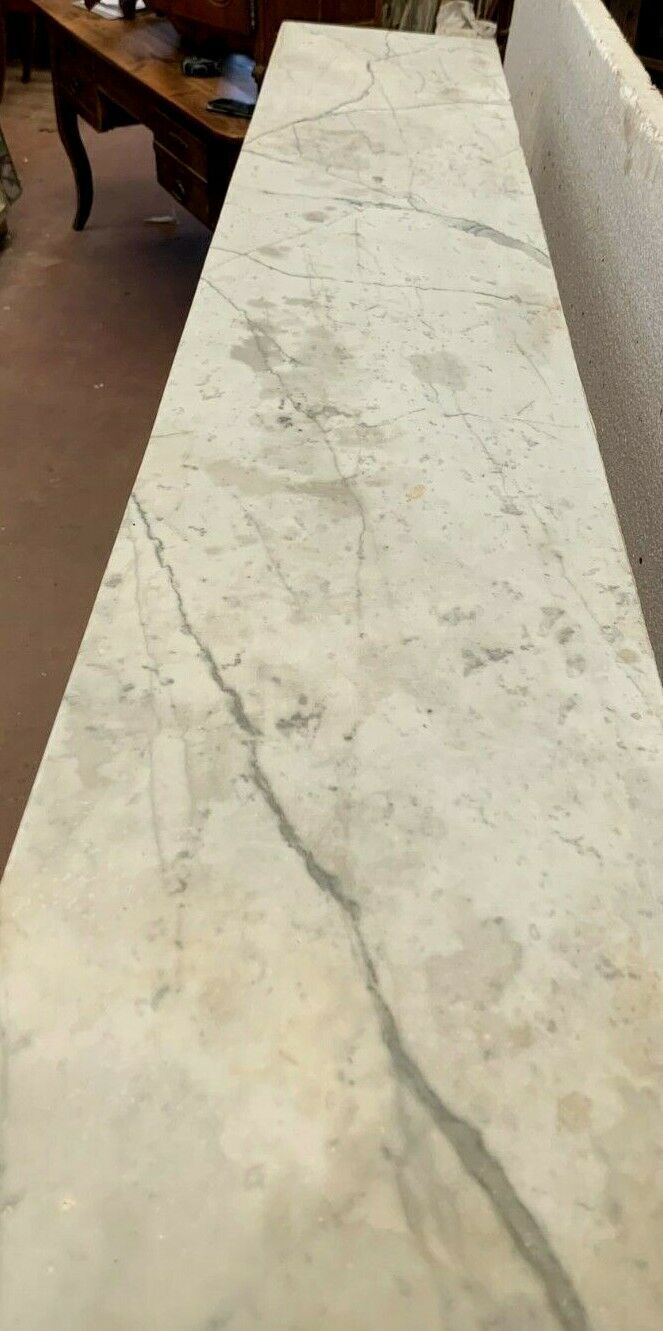 Louis XVI fireplace in 19th century white Carrara marble