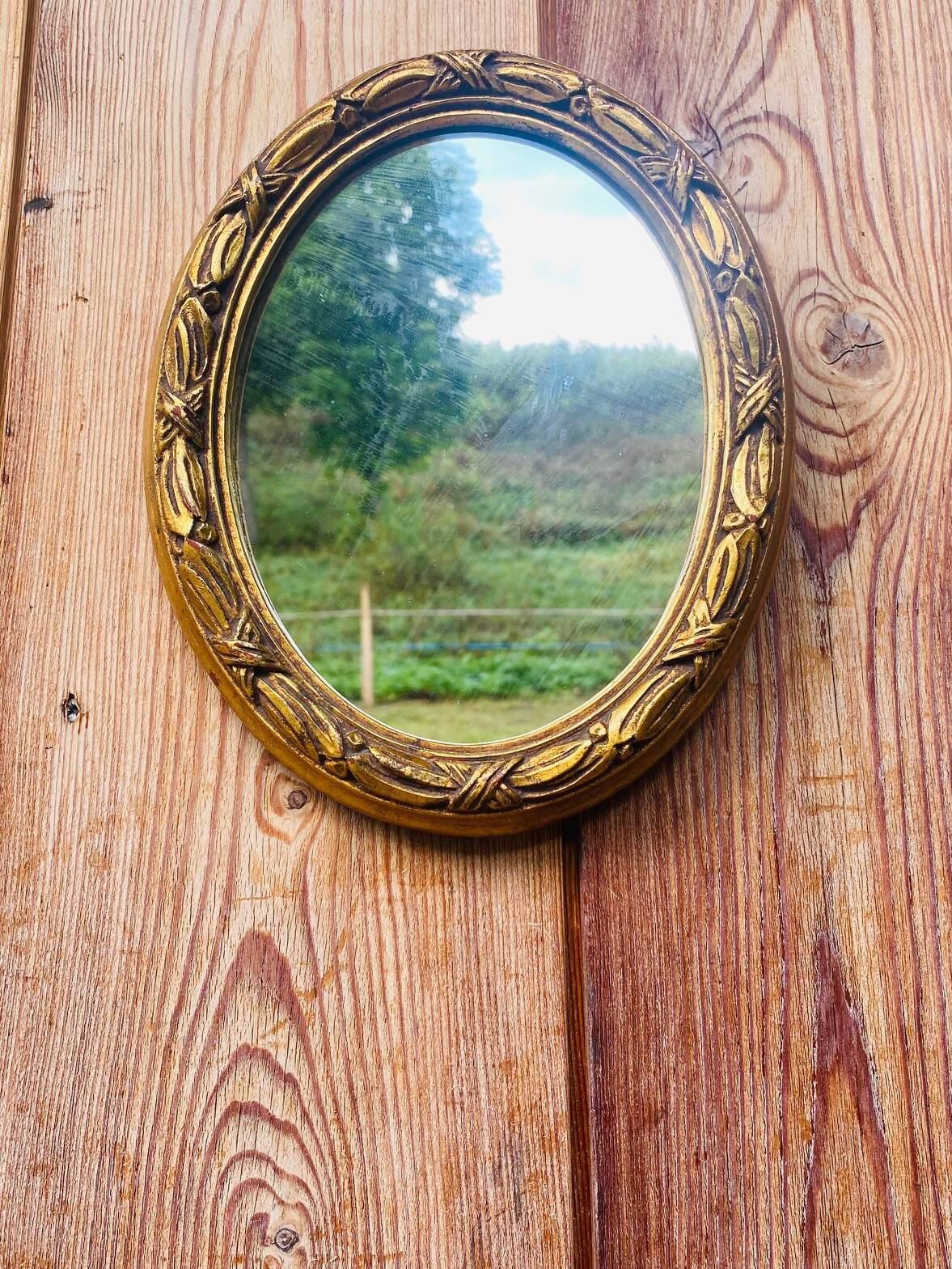 Small antique oval gilt mirror