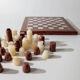 Vintage marble chess set from the 1960s, cream, burgundy and gold board with metal inlay, stone pieces.