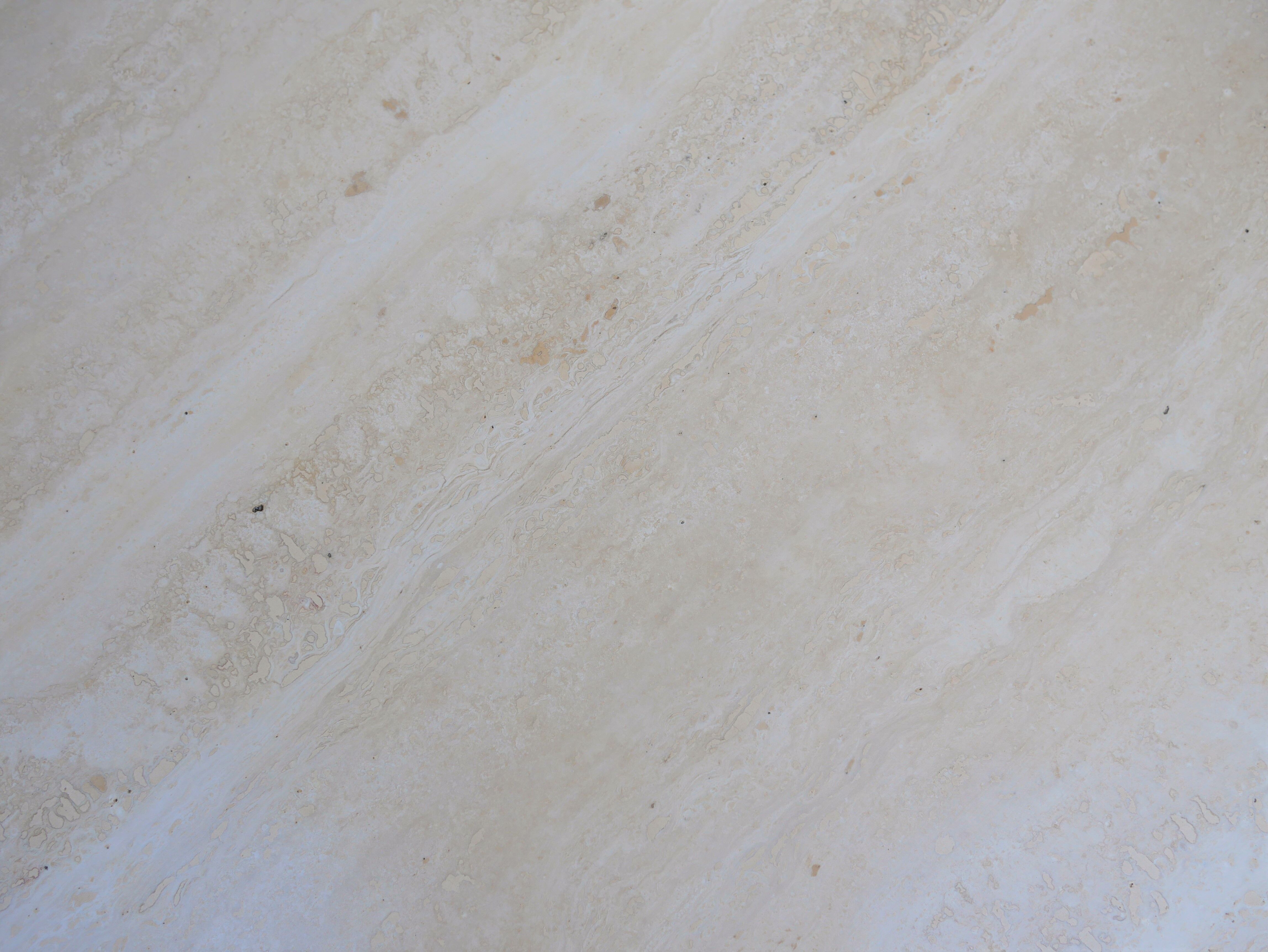 Coffee table in travertine by Roche Bobois editions