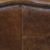 Large sheep leather wingback chair correctly finished with decorative nails