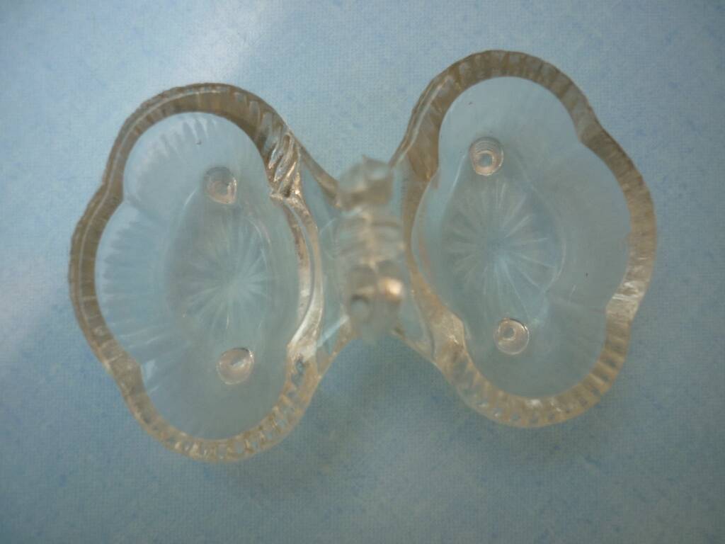 Molded glass salt and pepper service on feet