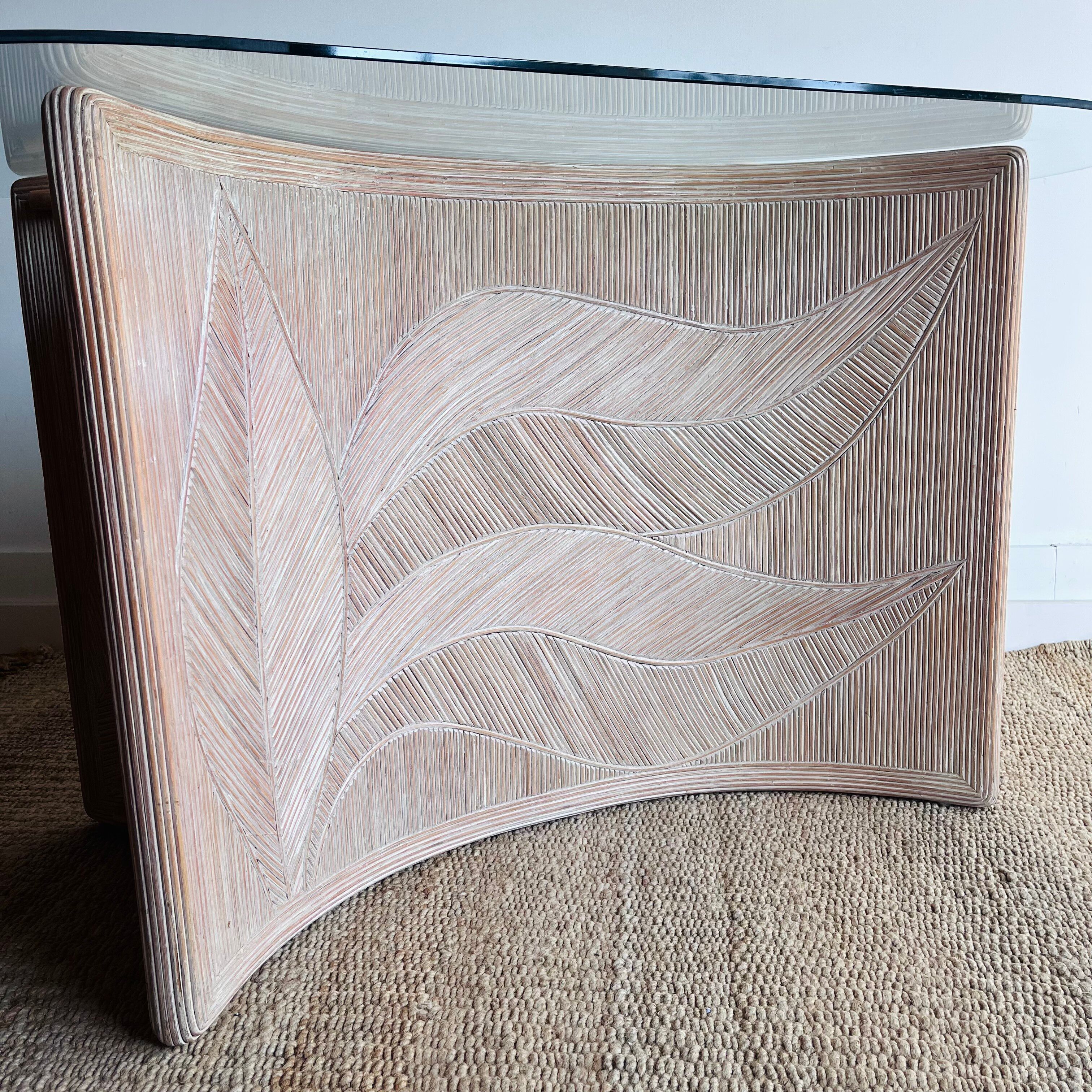 Italian side table with carved rattan and glass top.