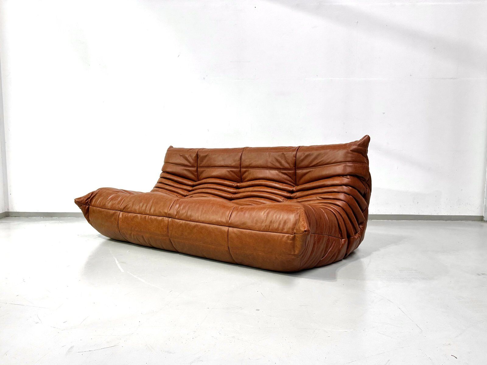 Togo sofa in cognac cowhide by Michel Ducaroy for Ligne Roset.