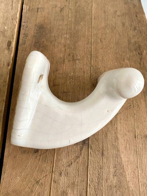 Enamelled earthen coat hook, 1900