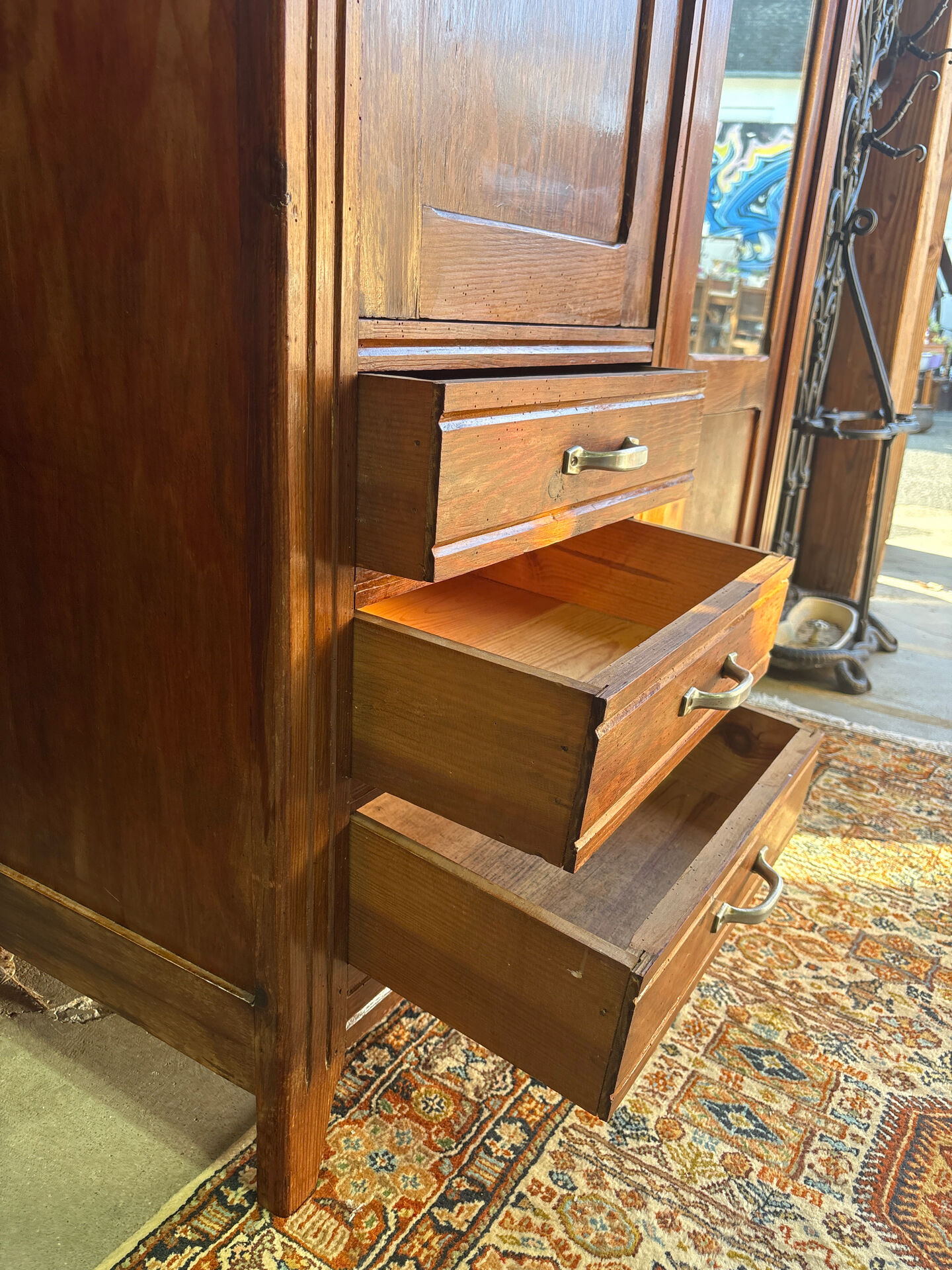 Antique Parisian wardrobe with mirror, hanging space and drawers.