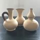 Trio of terracotta vases