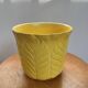 Yellow ceramic plant pot