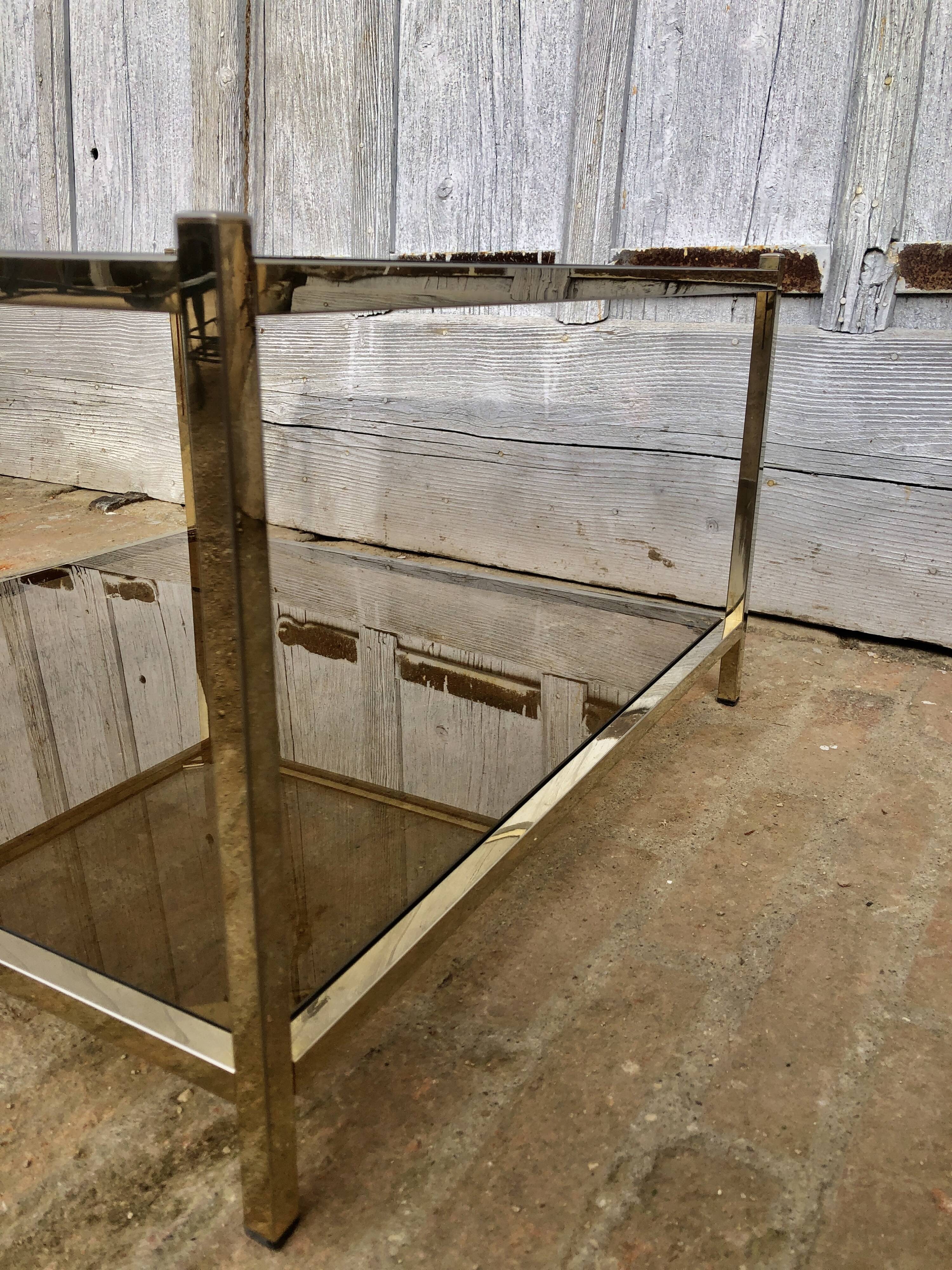 Square brass coffee table and smoked glasses