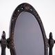 Art Nouveau table mirror with ornamental metal frame, early 20th century