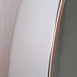 Round mirror covered with leather and chrome, made in France in the 1970s.