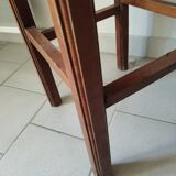 Antique campaign stool in solid wood with a straw seat.