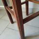 Antique campaign stool in solid wood with a straw seat.