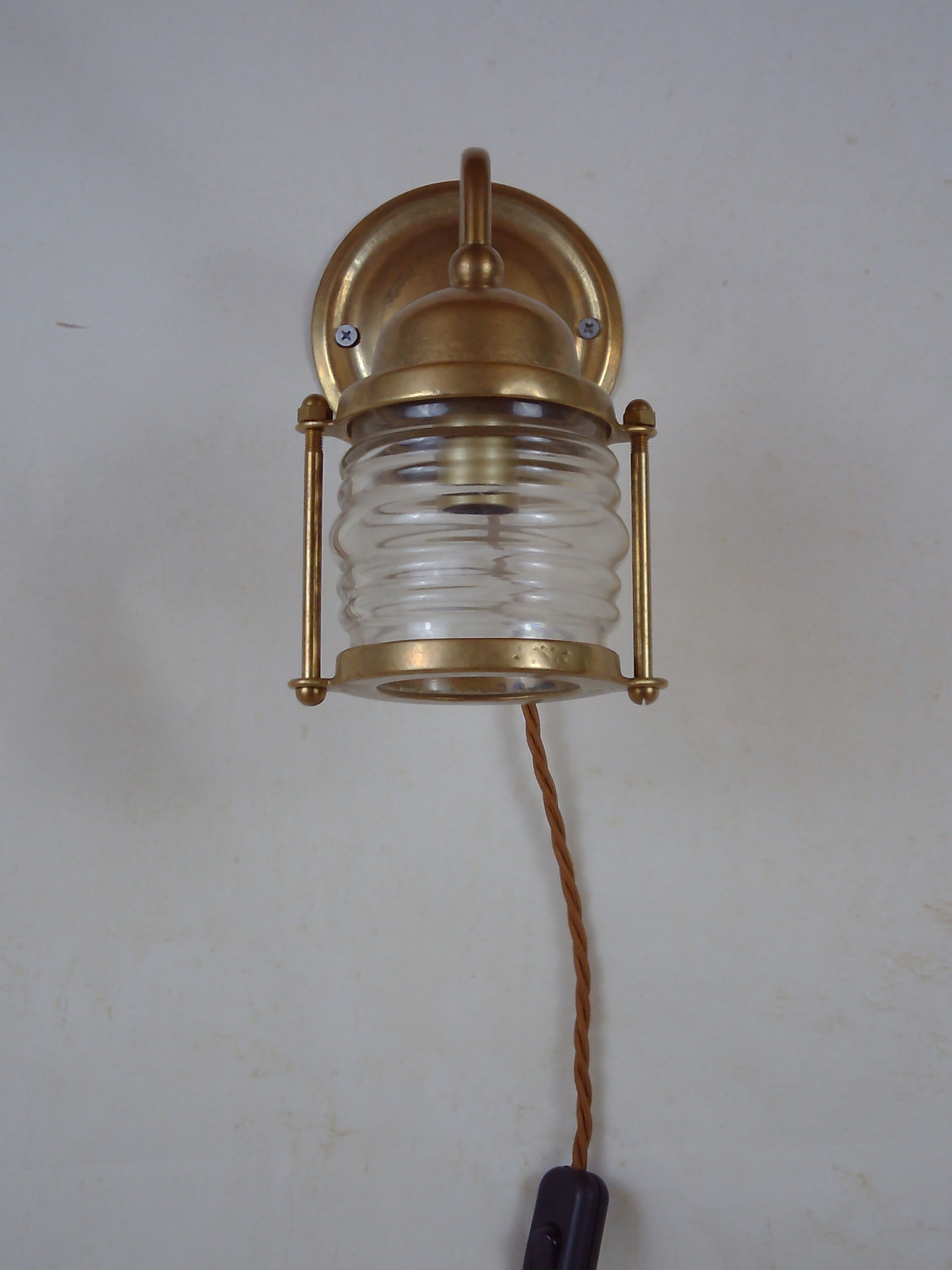 Vintage wallmounted brass lamp from a ship.